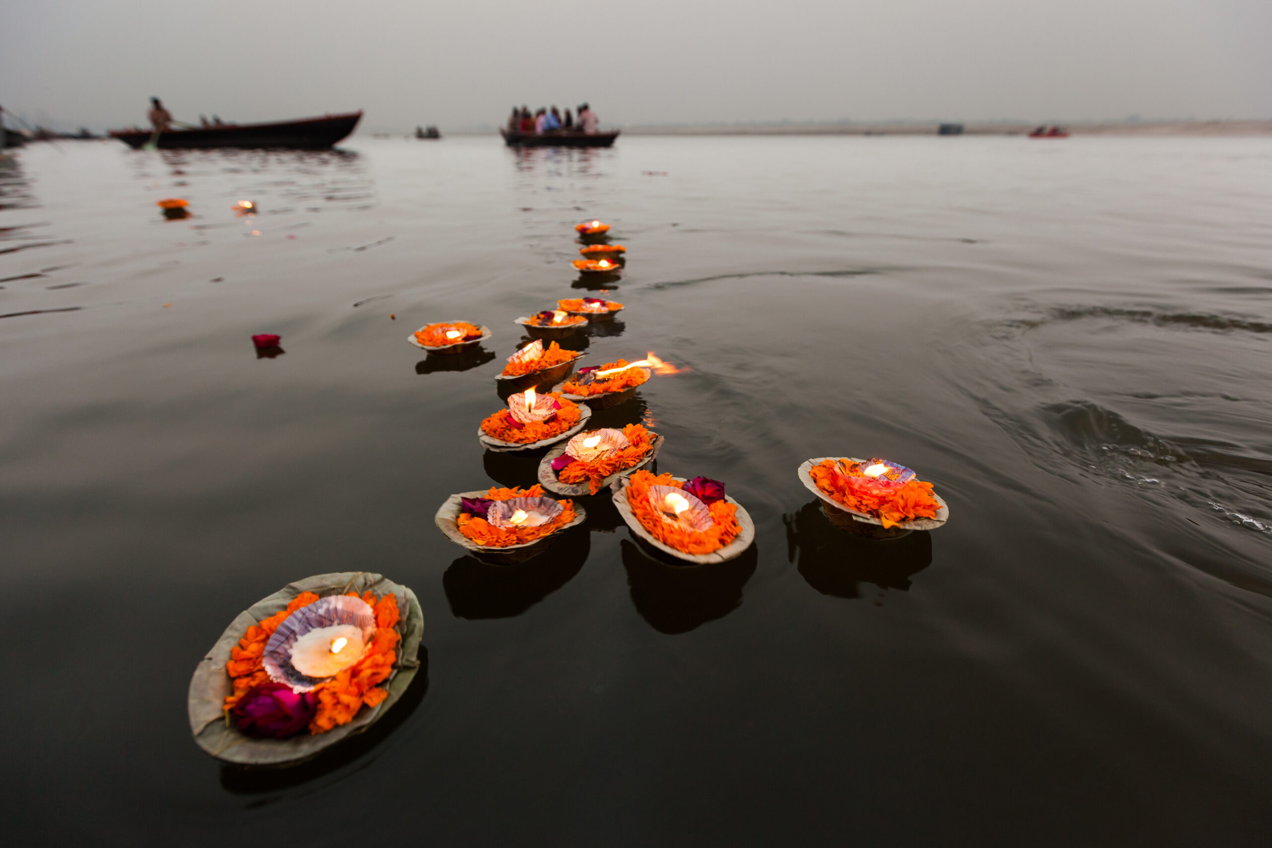 Candles floating in the Ganges River, Varanasi, India